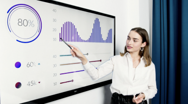 Woman Standing in Front of a Large Chart